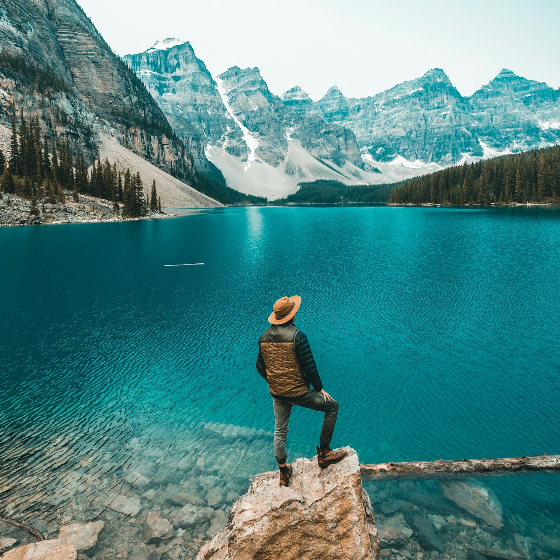 a-man-watching-natures-beautiful-green-lake-view